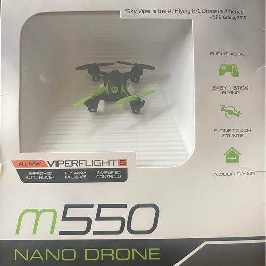 Nano quadcopter drone with green arms and black body, m550 model