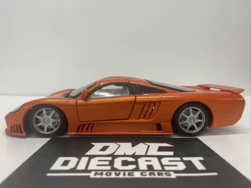Orange 1:18 scale diecast sports car with gray wheels and side vents
