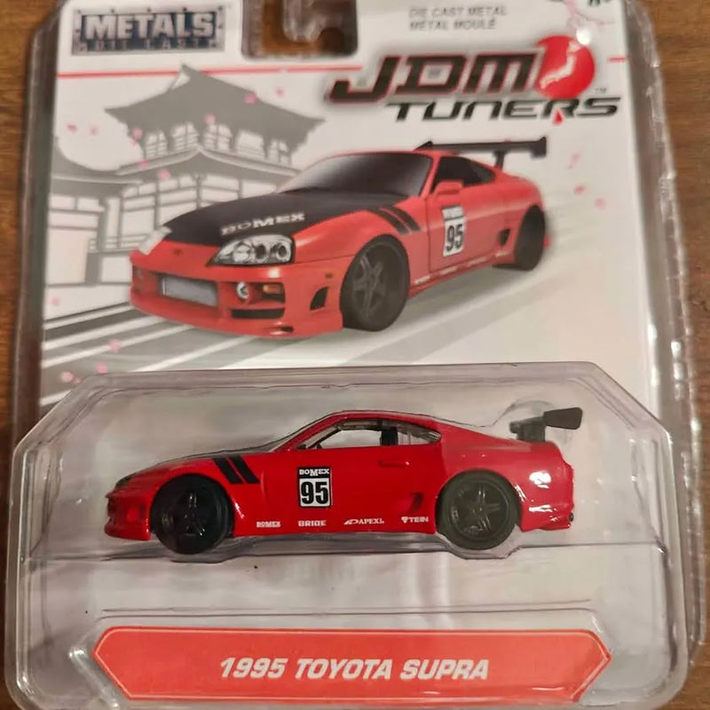 Red 1995 Toyota Supra JDM Tuners diecast car in clear display case