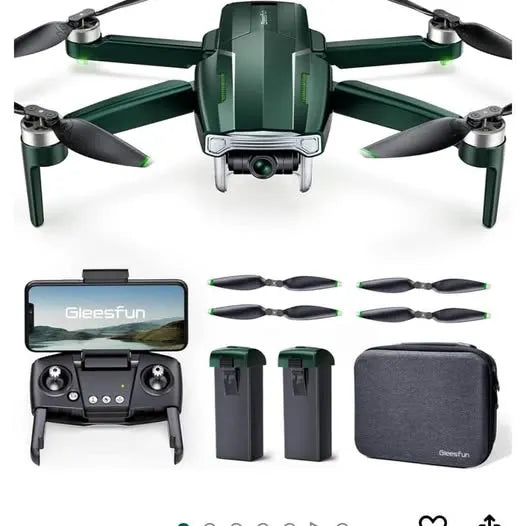 Green quadcopter drone with controller, spare propellers, batteries, and carry case
