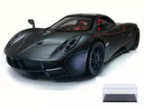 Dark diecast sports car model with detailed wheels and front bumper