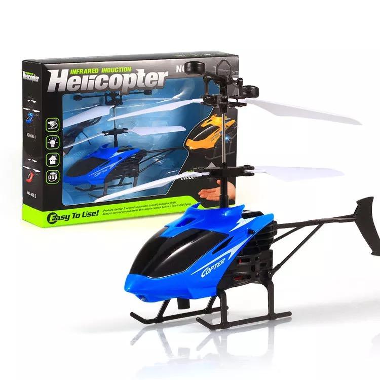Mini RC helicopter drone with blue and black body and spinning rotor blades