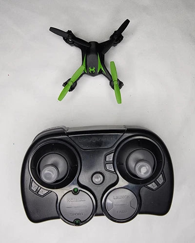 Nano quadcopter drone with green accents and black controller with two joysticks