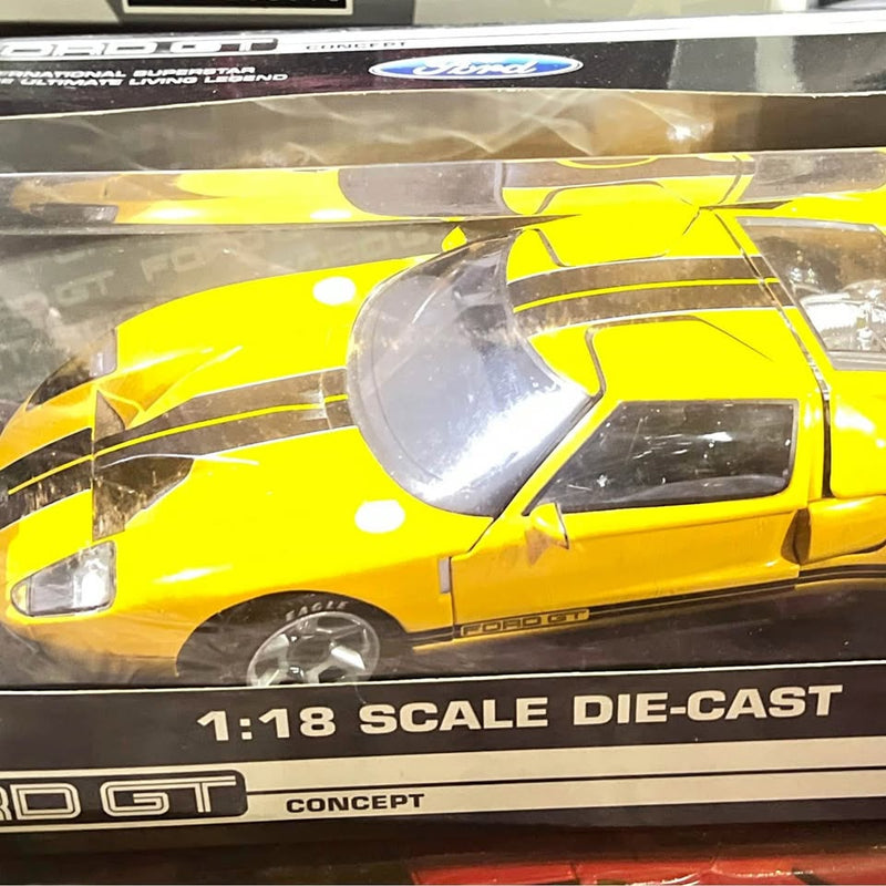 Yellow Ford GT 1:18 scale die-cast sports car in blister packaging