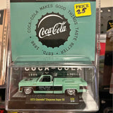 Mint green 1973 Chevrolet diecast model pickup with Coca-Cola graphics.