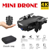 Foldable quadcopter drone with built-in camera, with protective clutch bag
