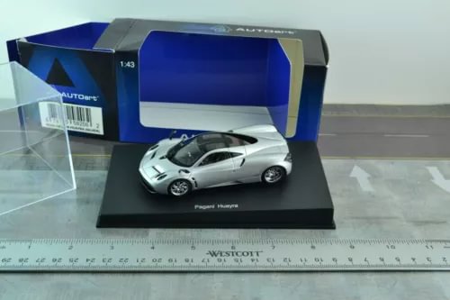 Silver diecast supercar model on display base in AUTOART box, 1:43 scale