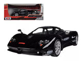Black diecast sports car model with open-wheel front and detailed headlights