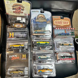 Diecast car lot of 10 in blister packs, assorted green and neutral vehicles