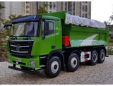Green die-cast dump truck model with black grille and front cab, rear dump bed