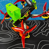 FPV racing drone with neon green canopy and red orange propellers