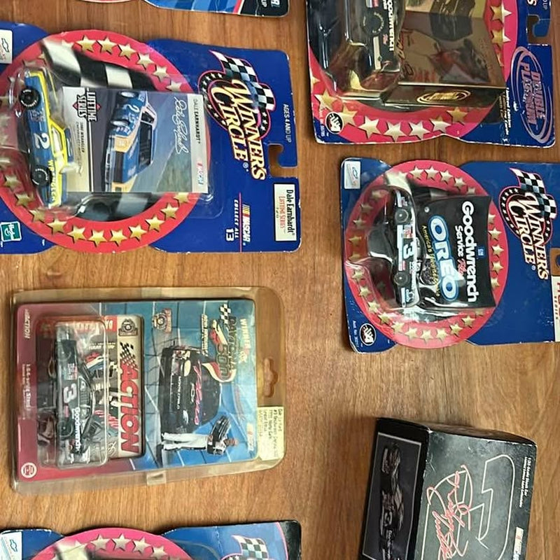 NASCAR diecast cars in blister boxes, Mesa AZ branding, blue and red packaging