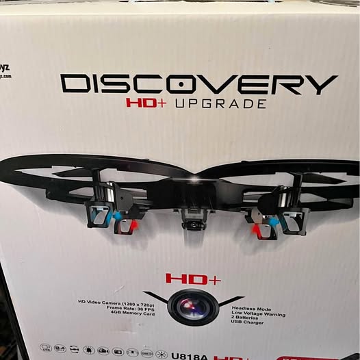 Quadcopter drone box showing underside with four propellers and HD+ upgrade