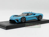 Blue electric supercar diecast model with black spoiler and wheels on display base