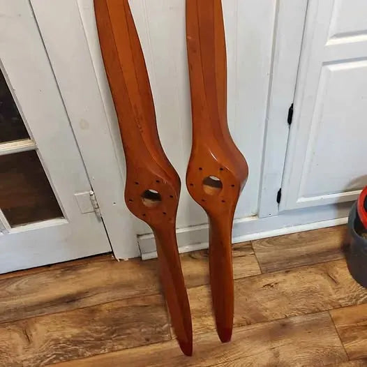 Drone propeller blades, orange-brown, two blades with circular mounting holes