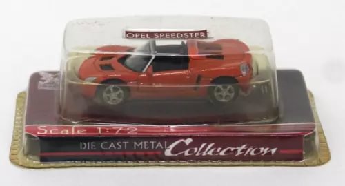 Orange diecast Opel Speedster model car in clear blister packaging