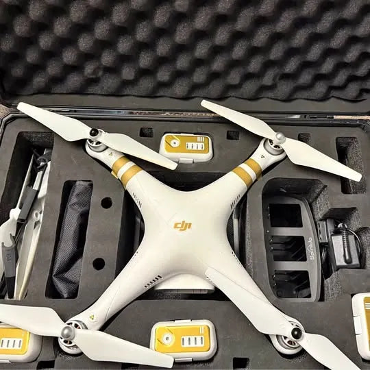 White DJI Phantom 3 Pro quadcopter drone with four propellers