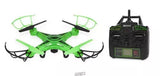 Green quadcopter camera drone with four propellers and handheld remote controller