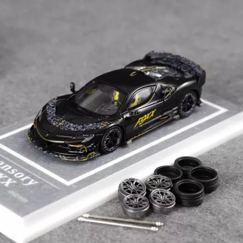 1/64 scale Ferrari MANSORY F9XX matte black diecast car with yellow decals, front three-quarter