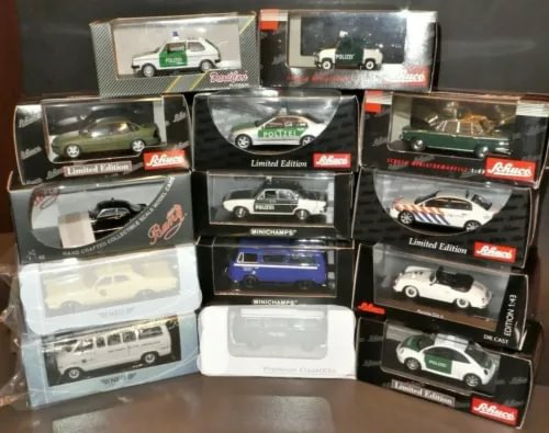 Police diecast car set, 1/43 scale, assorted vehicles in display boxes