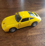 Yellow 1/36 scale diecast sports car toy with black windows and silver wheels