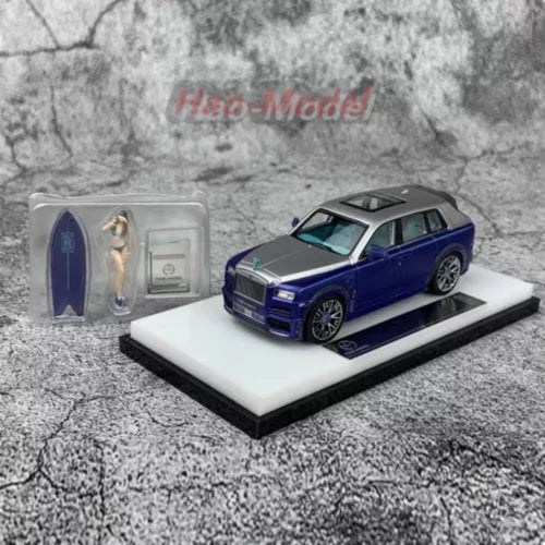 Diecast SUV model car on display base, dark blue with detailed grille and wheels