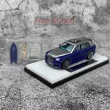 Diecast SUV model car on display base, dark blue with detailed grille and wheels