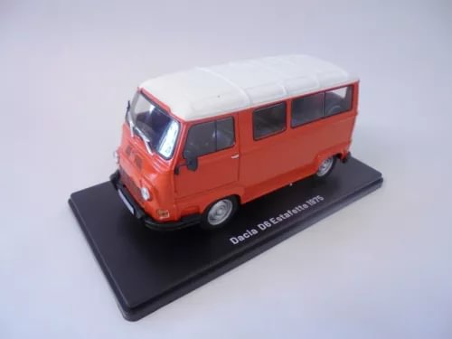 Red diecast miniature van with white roof, front three-quarter view on display base