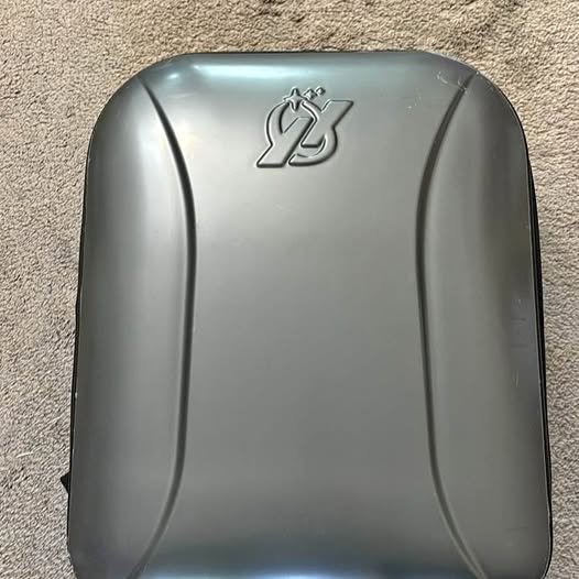 Gray metallic drone shell with central emblem