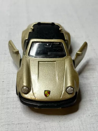 1/36 scale gold Porsche 911SC diecast model toy car, front view
