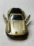 1/36 scale gold Porsche 911SC diecast model toy car, front view