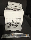 Gray foldable drone kit with controller and accessories in box