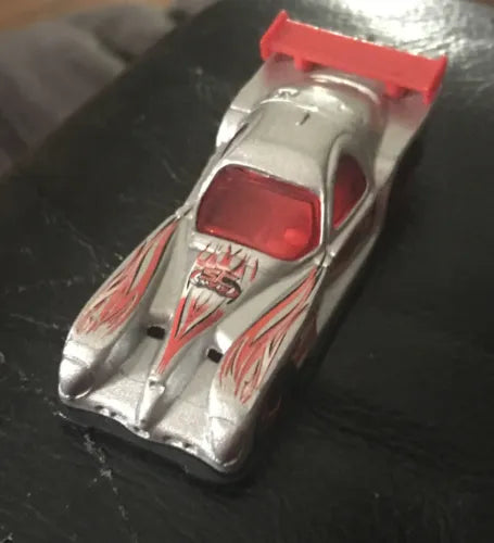 Die-cast toy race car with silver body and red windshield, front angled view