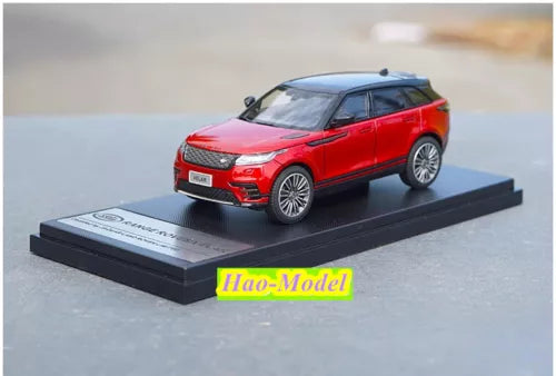 Land Rover diecast SUV model car, red with black wheels on display base