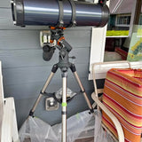 Celestron telescope with black tripod and optical tube