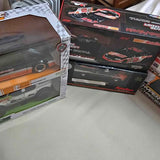 Diecast car in clear-front box with checkered packaging and orange stripe