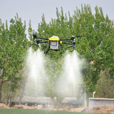 Carbon fiber farm drone with yellow top, quadcopter arms, spraying mist