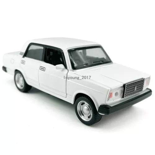 White diecast model car with openable doors, front 3/4 view