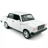 White diecast model car with openable doors, front 3/4 view
