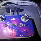 Drone controller with dual joysticks and purple galaxy display