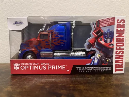 Optimus Prime 1:32 diecast model truck with robot figure in retail box, red and blue