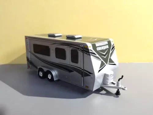 Black and white camper travel trailer diecast model with front hitch, 1/64 scale
