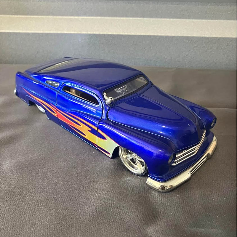 Blue diecast 1951 car with flame decal, chrome front bumper