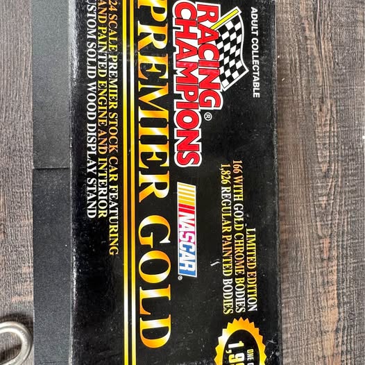 R.C. Premier Gold NASCAR diecast bank box with racing-themed typography and logo