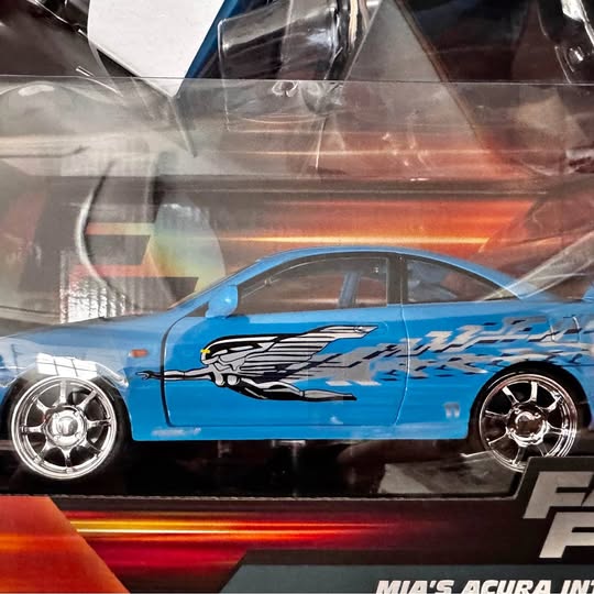 1:24 scale diecast sports car, blue with racing graphics and chrome wheels