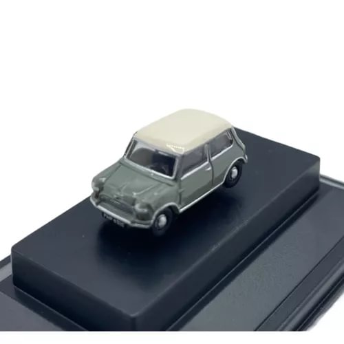 Grey diecast mini car with light roof on black display base, 1:148 scale