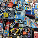 Assorted diecast car lot with multiple boxed toy vehicles and parts