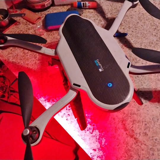 GoPro Karma drone with white body and black propellers, folded arms and landing legs visible