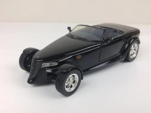 Black 1:24 scale diecast car model with front-left view