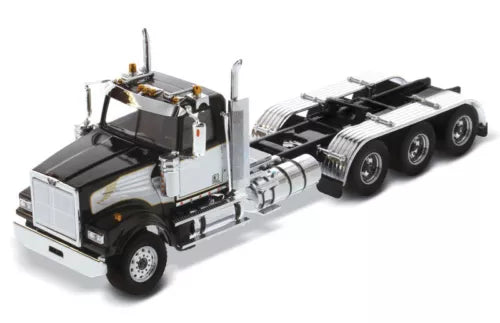 Black and white die-cast semi tractor truck with chrome grille and tridem wheels